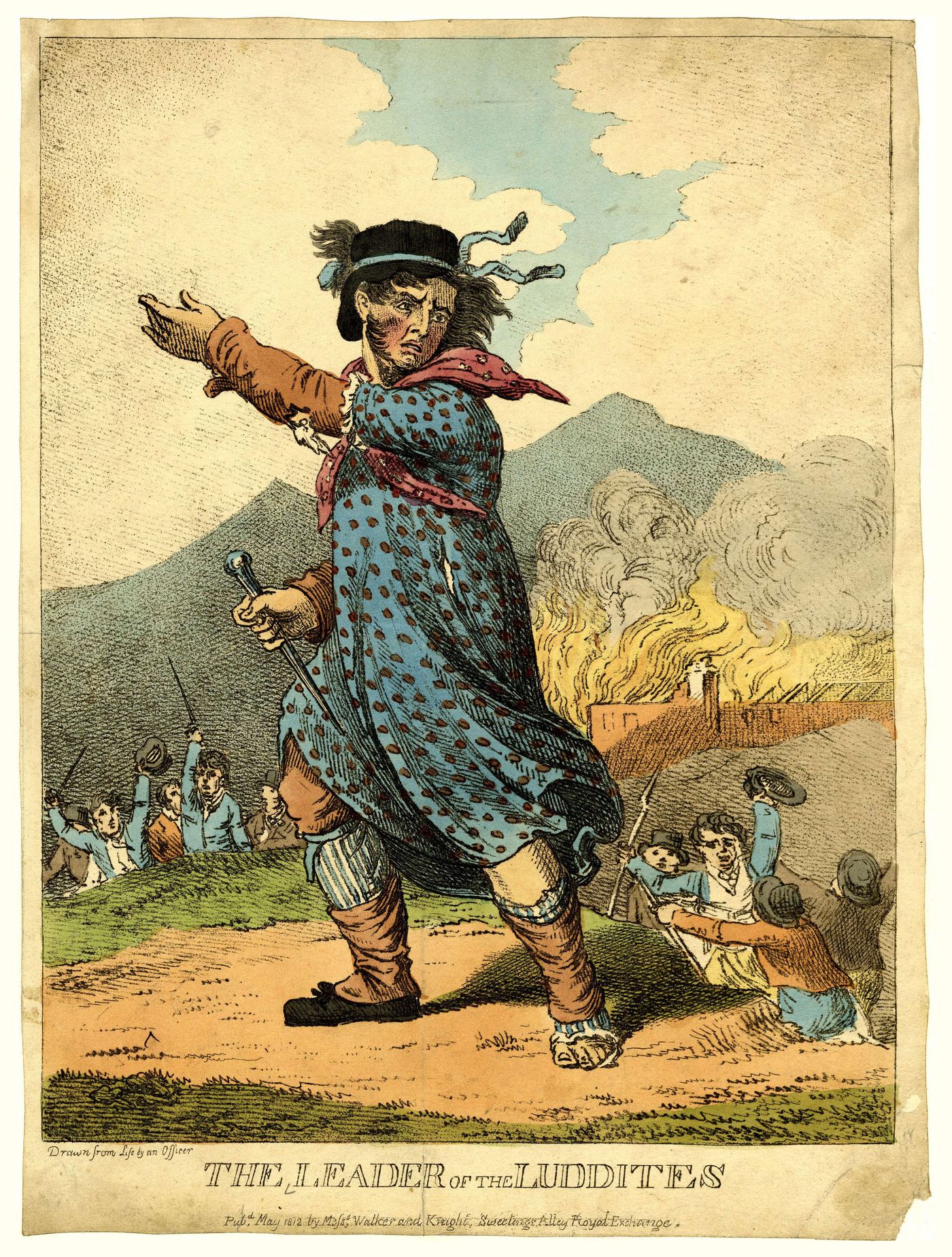 A hand-coloured 1812 engraving titled "The Leader of the Luddites": a man in women's clothing — polka-dot dress, red neckerchief, black hat — stands in the foreground brandishing a hammer, while workers destroy machinery and a mill burns on the hillside behind.